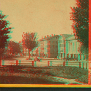 [Upper Main St. showing commons in foreground, 4-story buildings beyond.] 1869?-1880?