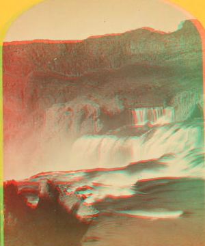 Shoshone Falls, Snake River, Idaho. Main fall, 210 feet from upper to lower level; height of caÒon walls at the falls, 1,000 feet. A number of minor falls, islands, and boulder rocks among the main falls add beauty to the lonely majesty of this scene. 1874