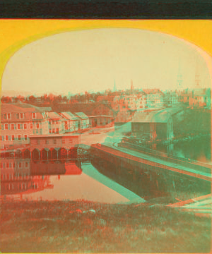 [View of a bridge over a river, town in background.] 1870?-1880?