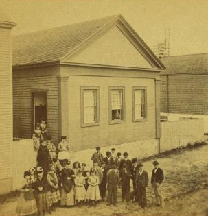 [Group of children in front of a building.] 1867?-1890?