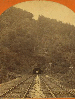 [Railroad tunnel and tracks through mountain.] 1860?-1900?
