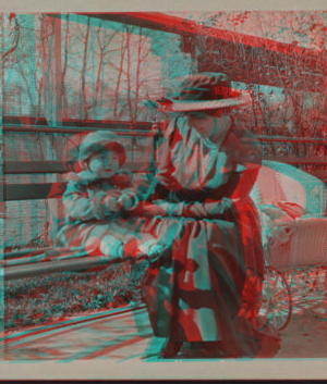 [Mother and child sitting in a park.] 1915-1919 October 1917