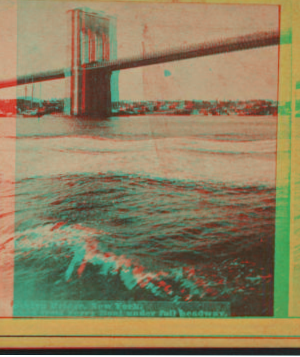 Brooklyn Bridge, New York. (Taken from ferry boat under full headway.) [1867?-1910?]