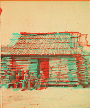 Uncle Ben's cabin. [Elderly couple sitting in front of a cabin.] 1868?-1900?