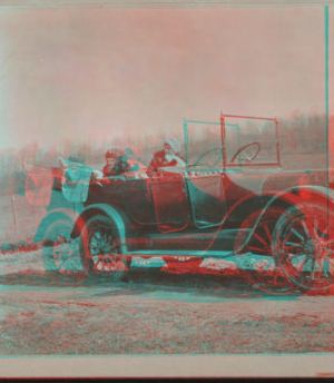 [Women attending to a child in touring car.] 1915-1919 April 1916