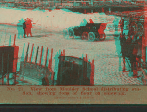 View from Moulder School distributing station, showing tons of flour on sidewalk. 1906