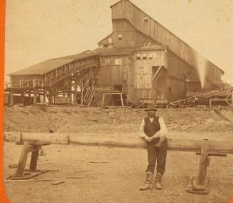 Man in front of breaker at Hollywood Colliery. 1870?-1880?