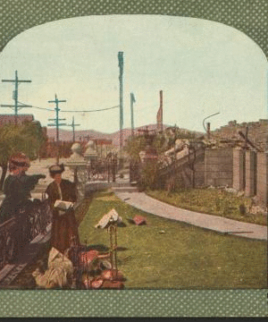 Gathering a few home relics at the ruins of the at the ruins of the Wenban Palace, Van Ness Ave., San Francisco. 1906