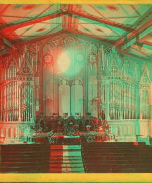 [Interior of a church showing the altar, a large organ, and painted ceiling.] 1865?-1903