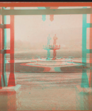 [View of fountain from inside entrance of building.] 187-?