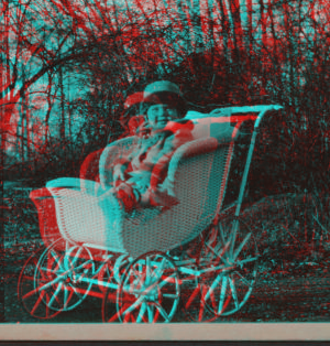 [Child sitting in a carriage.] 1915-1919 October 1917