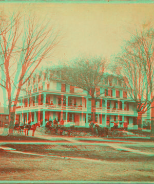 [View of large house with people and wagons in front.] 1865?-1905?