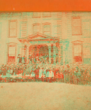 [Students in front of the schoolhouse.] 1865?-1880?