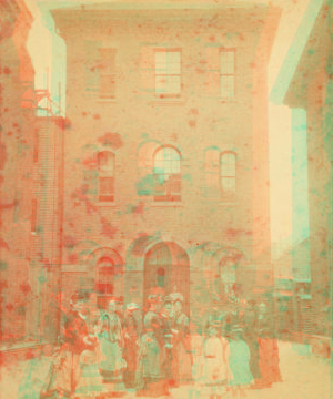 [Women and children in front of narrow three story building.] 1865?-1885?