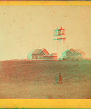 [Veiw of a lighthouse with a man standing in the foreground.] 1863?-1885?