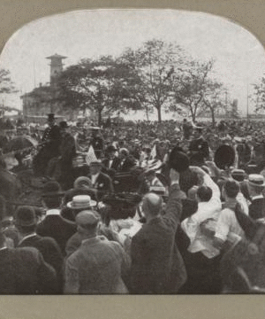 Castle Garden, now the aquarium, with a very interesting foreground [large crowd of people, some waving at a procession, in foreground]. 1865?-1910?