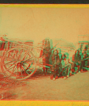 [Group of Indians and "Red River carts".] 1870?-1880?