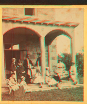 [Family gathering in the front porch.] 1860?-1869?