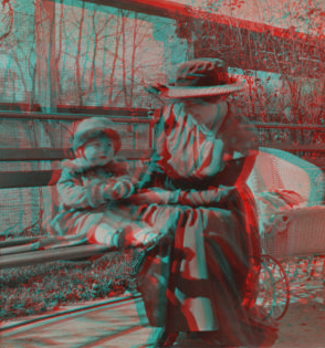 [Mother and child sitting in a park.] 1915-1919 October 1917