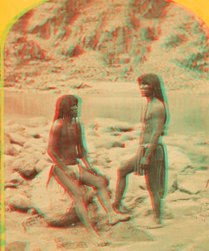 Types of Mojave Indians. [Two Mojave men pose on rocks in front of the river.] 1871