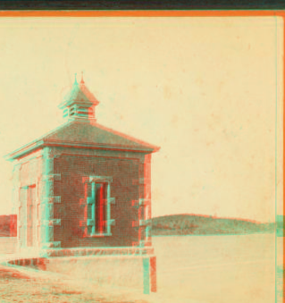 [Small building on the edge of a lake, possibly a gatehouse for a water system.] 1865?-1880?