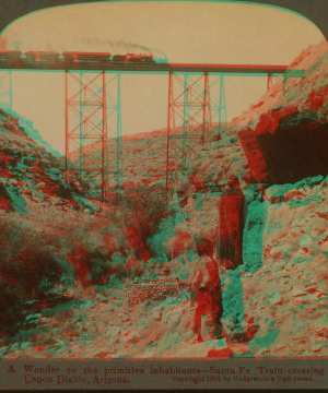 A wonder to the primitive inhabitants--Santa Fe train crossing Canon Diablo, Arizona. 1870?-1910?