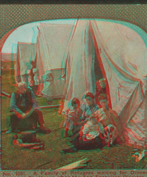 A family of refugees waiting for dinner in camp at Ft. Mason after the San Francisco disaster. 1906