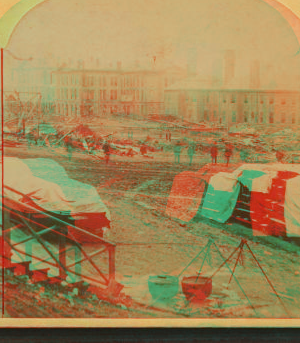 A view taken from the rear of the P. R. R. depot. In the middle ground are seen the stores and offices of the Cambria Iron Co., and in the foreground are coffins and bodies just arrived from the morgues and ready for shipment. 1889