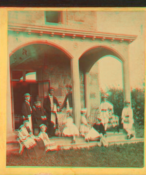 [Family gathering in the front porch.] 1860?-1869?