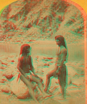 Types of Mojave Indians. [Two Mojave men pose on rocks in front of the river.] 1871