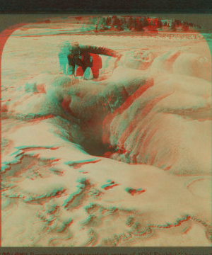 Peering into the mysterious crater of 'Old Faithful,' between its eruptions, Yellowstone Park, U.S.A. 1901, 1903, 1904