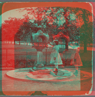 Drinking fountain on the mall. [Girl in a dress at the fountain.] 1860?-1905?