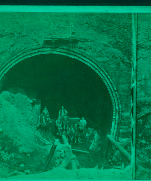 [Workers at mouth of tunnel.] 1865?-1885