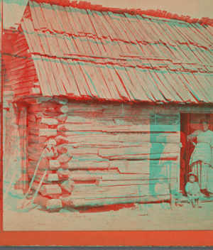 Happy little nig. [Woman and a small child in a cabin doorway.] 1868?-1900?