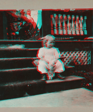 [Child sitting on steps with doll.] 1915-1919 April 1916