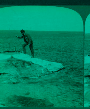 Fisherman at lake turning to cook in a boiling spring the trout just caught, Yellowstone Park, U.S.A. 1901, 1903, 1904