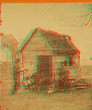 [Man in a top hat in front of a shack with several boys with books.] 1868?-1900?