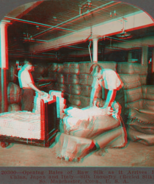 Opening bales of raw silk as it arrives from China, Japan and Italy. Silk industry (reeled silk), South Manchester, Conn., U.S.A. c1914 1914