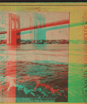 Brooklyn Bridge, New York. (Taken from ferry boat under full headway.) [1867?-1910?]