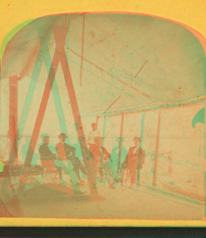 [View of men in chairs on the deck of a boat, shaded by a large canvas.] 1865?-1905? [ca. 1875]