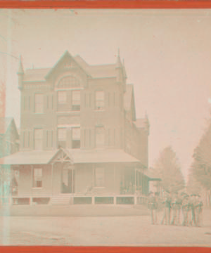 [Group of soldiers in uniform in front of building.] 187-?