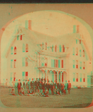 [Group portrait of men in front of a three-store house.] 1869?-1882?