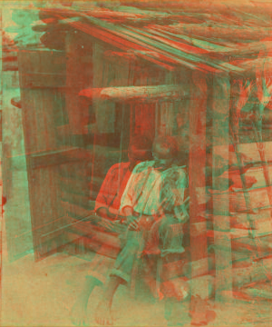 Happy little Bob. [Man playing fiddle in front of cabin.] 1868?-1900?