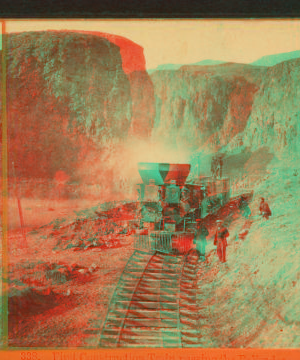 First construction train passing the palisades, Ten Mile CaÒon. 1866?-1872?