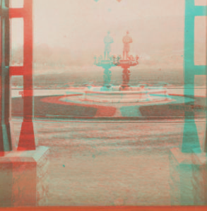 [View of fountain from inside entrance of building.] 187-?