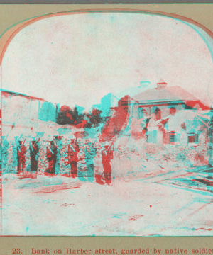 Bank on Harbor Street, guarded by native soliders. 1907