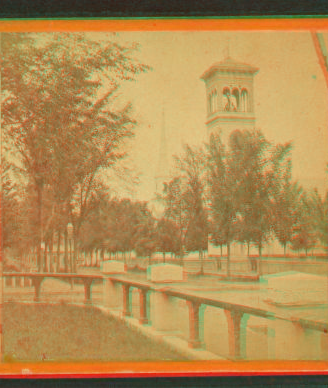 [View of Clinton showing fence, trees, the steeple of a church and a bell tower.] 1865?-1885?