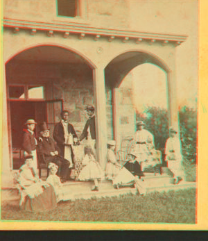 [Family gathering in the front porch.] 1860?-1869?