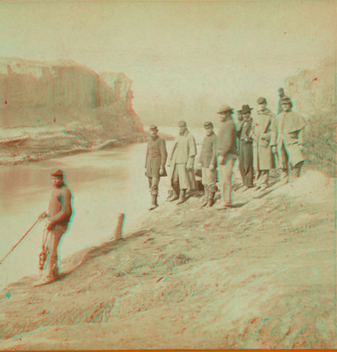 Dutch Gap canal and group of soldiers. Taken after the bank was blown out. On the extreme end a portion of the bank remains, which forms a profile, which the soldiers call Jeff Davis.