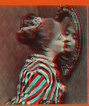 Woman kissing her reflection in the looking glass